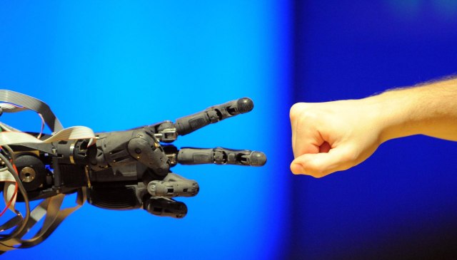 Rock, paper, scissors with Berti the robot at the Science Museum in London.  Ian Nicholson/PA Archive/PA Images