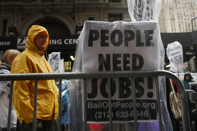 NEW YORK - APRIL 03:  People demonstrate in the financial district on April 3, 2009 in New York, New York. Dozens of anti-capitalist protesters gathered in the financial district to begin a two day rally against Wall St. and the recent government bailout of banks and financial institutions.  (Photo by Spencer Platt/Getty Images)