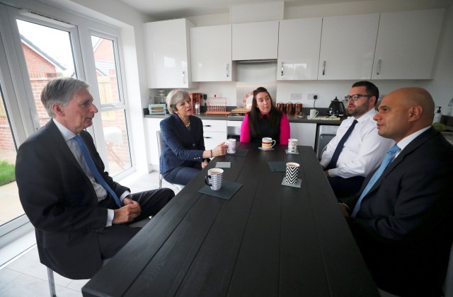 Prime Minister Theresa May, Chancellor Philip Hammond and Communities Secretary Sajid Javid visit a home purchased using Help to Buy. Credit:  Hannah McKay/PA Archive/PA Images