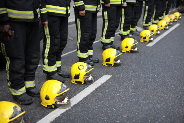 Firefighters during a silent march to mark the one year anniversary of the Grenfell Tower fire. Credit:  Dan Kitwood / Getty