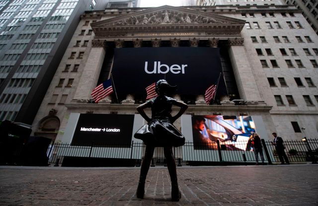 The "Fearless Girl" statue, outside the New York Stock Exchange ahead of the Uber IPO. Credit: Johannes Eisele/AFP/Getty