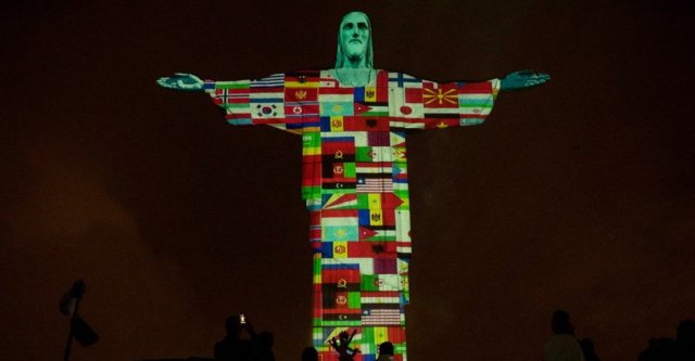 Christ the Redeemer has been lit up with a projection of flags of all the countries that have been affected by coronavirus