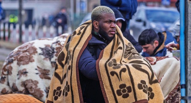 A student waiting to flee Ukraine Credit: Wojtek Radwanski/AFP/Getty