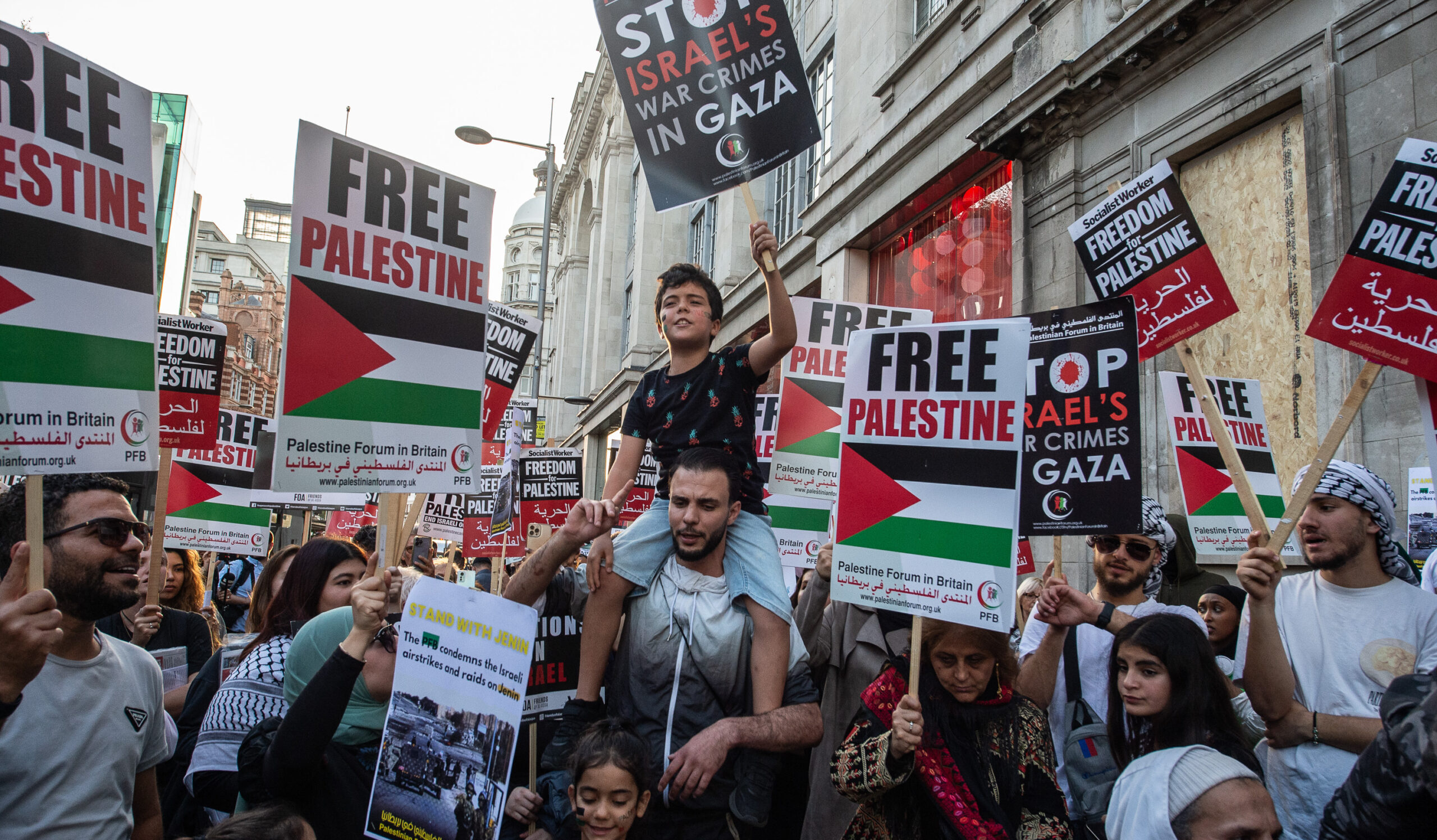 Pro-Palestine protestors gather near the Israeli embassy in London on Monday night. Credit: Getty