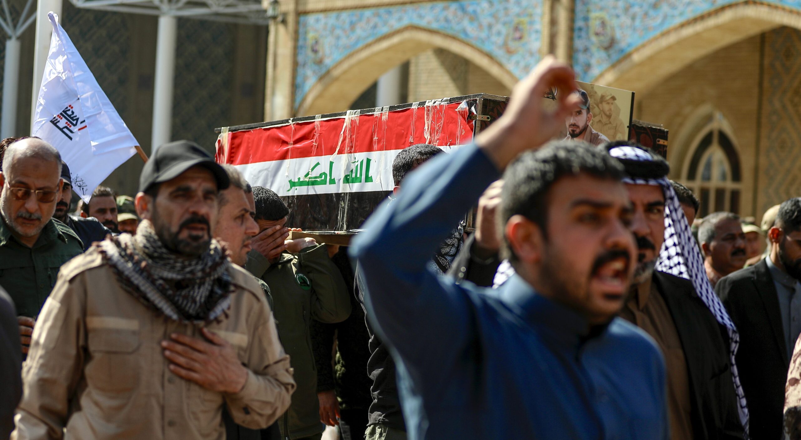 Mourners for the Popular Mobilization Forces members killed in US airstrikes in Iraq. Credit: Getty