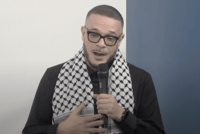 Shaun King dons a keffiyeh while he explains why he converted. Credit: YouTube