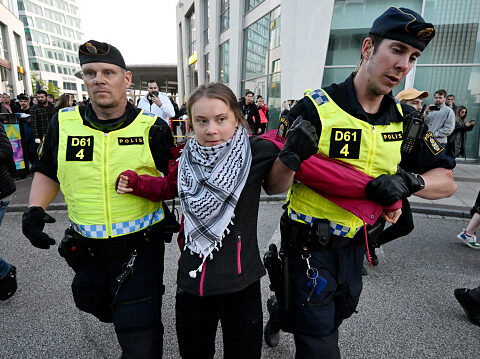 Why is Greta wearing a Keffiyeh?