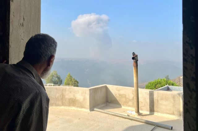 A man looks on after an Israeli airstrike in the southern Lebanese village of Qsair on Sunday. Credit: Getty