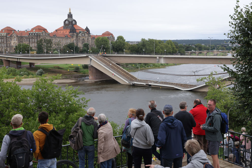 Onlookers view the partially collapsed Carola Bridge in Dresden this week. Credit: Getty