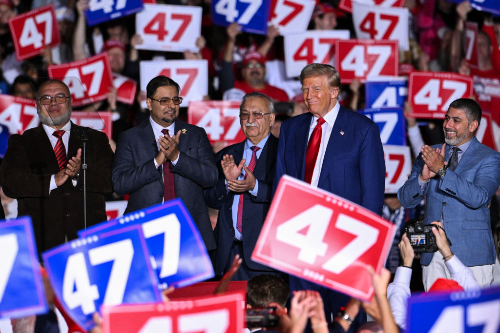 Donald Trump with Muslim leaders at a rally in Michigan last month. Credit: Getty