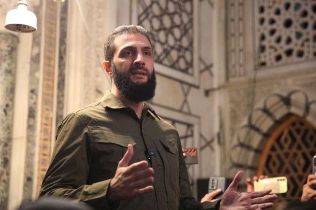 HTS leader Abu Mohammed al-Jolani in Damascus on Sunday. Credit: Getty