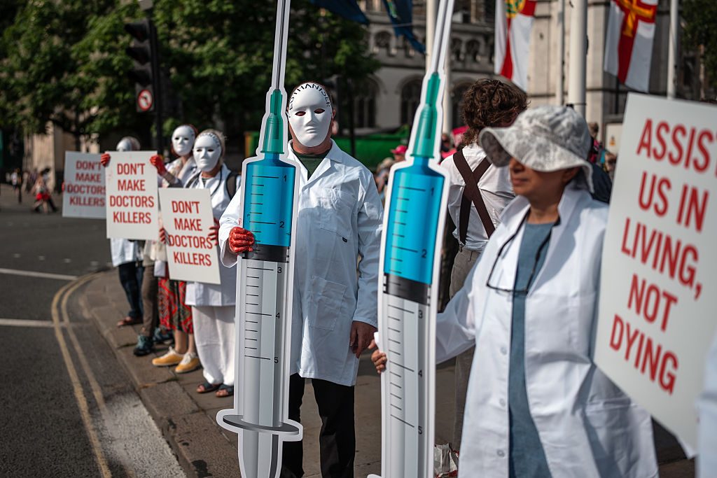 Protesters against the assisted dying bill in Westminster today. Credit: Getty