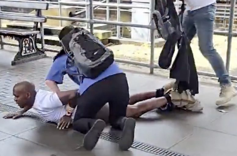 A man who exposed himself on an Underground train last week is restrained by other passengers. Credit: CrimeLDN/X