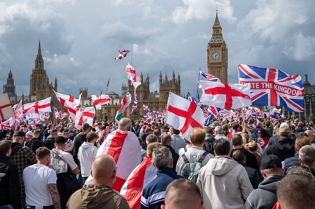 Members of the public attend Saturday's rally in Westminster. Credit: Getty