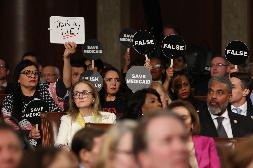 Some Democrats held protest signs during Trump’s address to Congress in March last year. Credit: Getty
