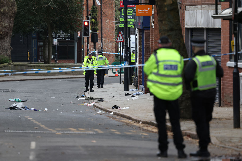 Police officers attend the scene of the incident in Derby on Sunday. Credit: Getty