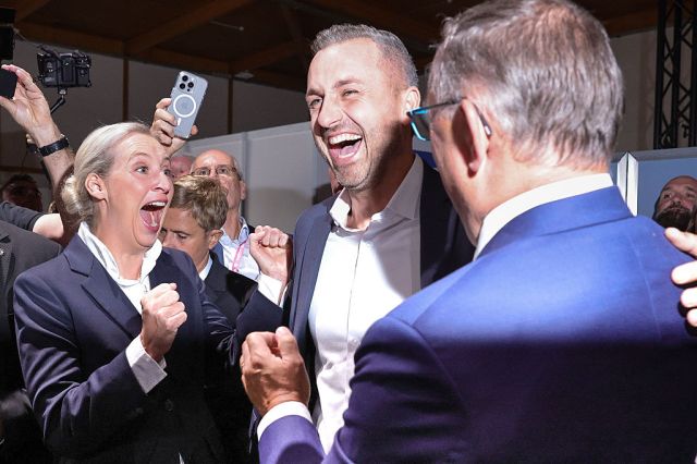 AfD party leader celebrates last night's result with Saxony-Anhalt AfD leader Ulrich Siegmund. Credit: Getty
