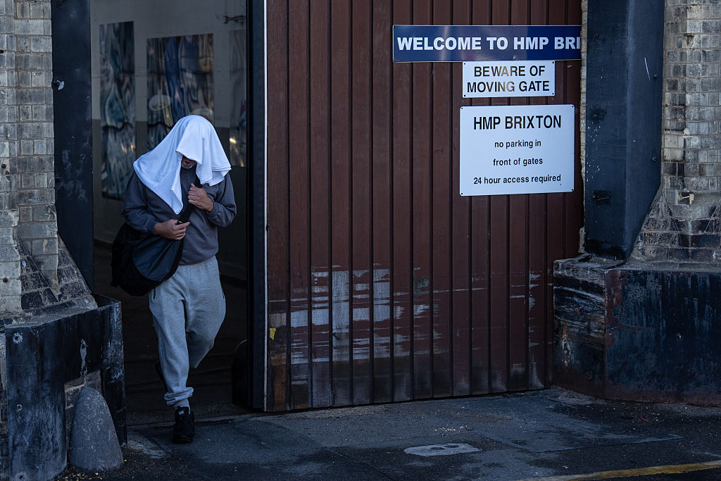 An inmate leaves HMP Brixton on early release this morning. Credit: Getty